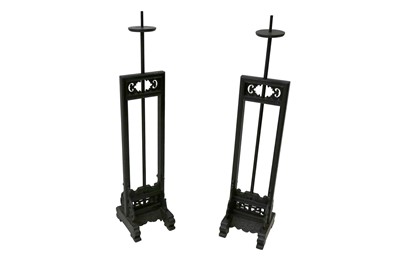 Lot 551 - A PAIR OF CHINESE BLACK LACQUERED ADJUSTABLE CANDLE STANDS