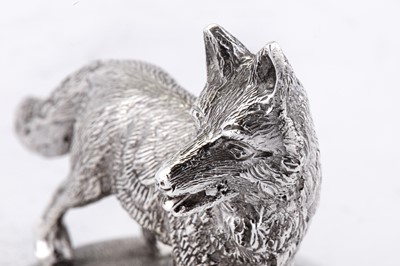Lot 30 - A modern cast unmarked silver model of a fox