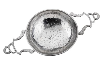 Lot 442 - An early 18th century unmarked silver lemon strainer, probably English circa 1730