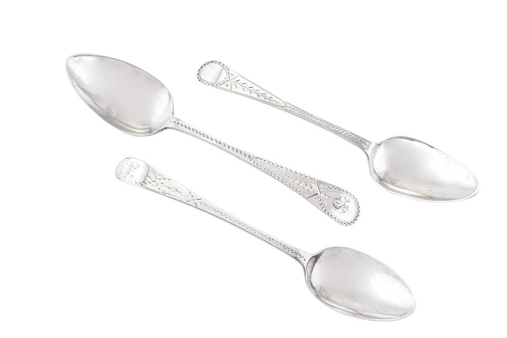 Lot 354 - Three George III sterling silver tablespoons