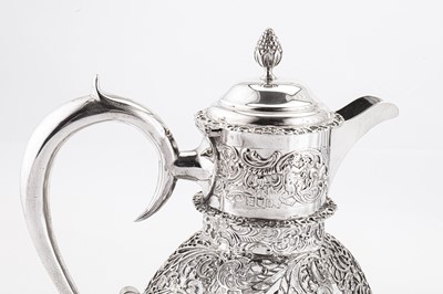 Lot 320 - An Edwardian sterling silver mounted cut glass claret jug, London 1904 by William Comyns