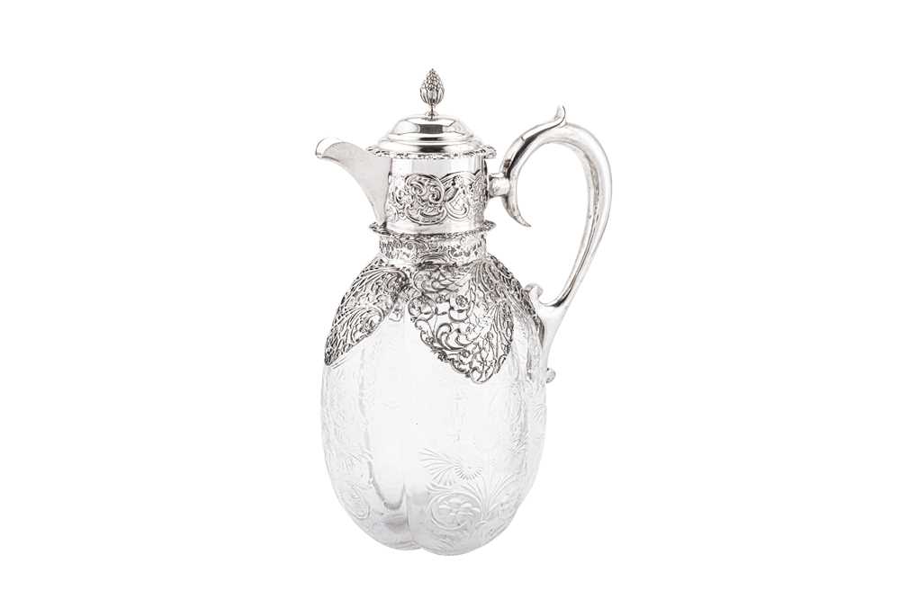 An Edwardian sterling silver mounted cut glass claret jug, London 1904 by...