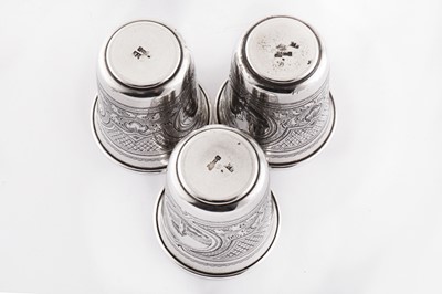 Lot 150 - A set of three Alexander II Russian 84 zolotnik (875 standard) silver and niello beakers (stopa), Moscow 1877 by З. З (unidentified, active circa 1871-80)