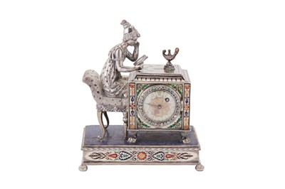 Lot 88 - An early 20th century Austrian unmarked silver and champlevé enamel figural table timepiece, probably Vienna circa 1910