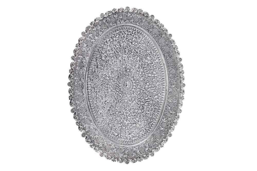 Lot 174 - A late 19th century Anglo – Indian silver tray, Cutch, Bhuj circa 1870 by Oomersi Mawji (active 1860-90)