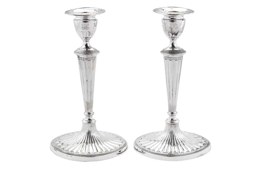 Lot 415 - A pair of George III sterling silver candlesticks, Sheffield 1785 by John Parsons & Co