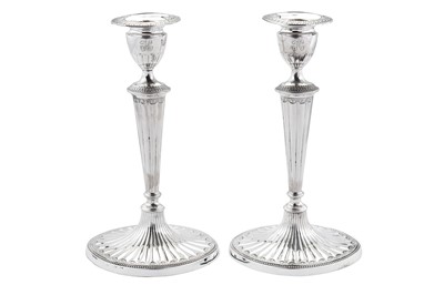 Lot 415 - A pair of George III sterling silver candlesticks, Sheffield 1785 by John Parsons & Co