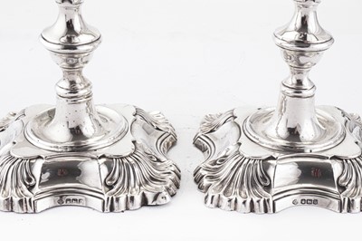 Lot 313 - A pair of George V sterling silver candlesticks, Sheffield 1919 by William Hutton and Sons