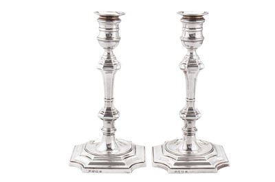 Lot 314 - A pair of George V sterling silver candlesticks, Birmingham 1913 by Elkington and Co