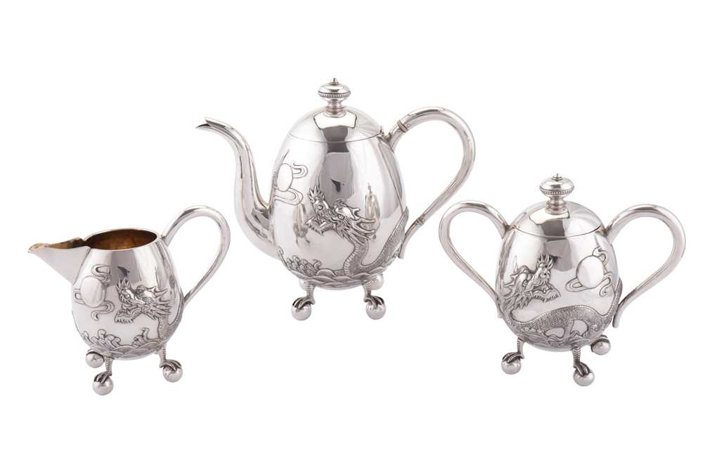 Lot 191 - An early 20th century Chinese Export silver three-piece tea service, Canton circa 1910, retailed by Hone Wo of Hong Kong