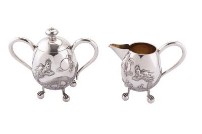 Lot 191 - An early 20th century Chinese Export silver three-piece tea service, Canton circa 1910, retailed by Hone Wo of Hong Kong