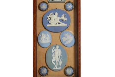 Lot 83 - A COLLECTION OF 19TH CENTURY WEDGWOOD JASPERWARE INTAGLIOS IN A CABINET