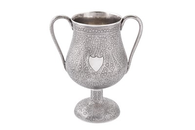 Lot 153 - A late 19th / early 20th century Anglo – Indian unmarked silver twin handled standing cup, Kashmir circa 1900
