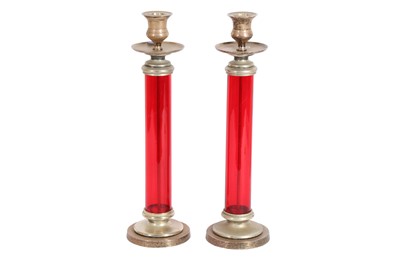 Lot 138 - A PAIR OF RED GLASS AND SILVER PLATED CANDLESTICKS, 20TH CENTURY