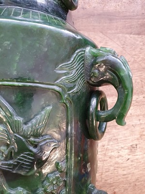 Lot 630 - A LARGE CHINESE SPINACH-GREEN JADE VASE AND COVER.