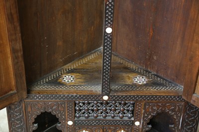 Lot 335 - λ A CARVED HARDWOOD MOTHER-OF-PEARL AND BONE-INLAID CORNER CUPBOARD
