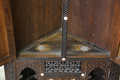 Lot 258 - λ A CARVED HARDWOOD MOTHER-OF-PEARL AND BONE-INLAID CORNER CUPBOARD