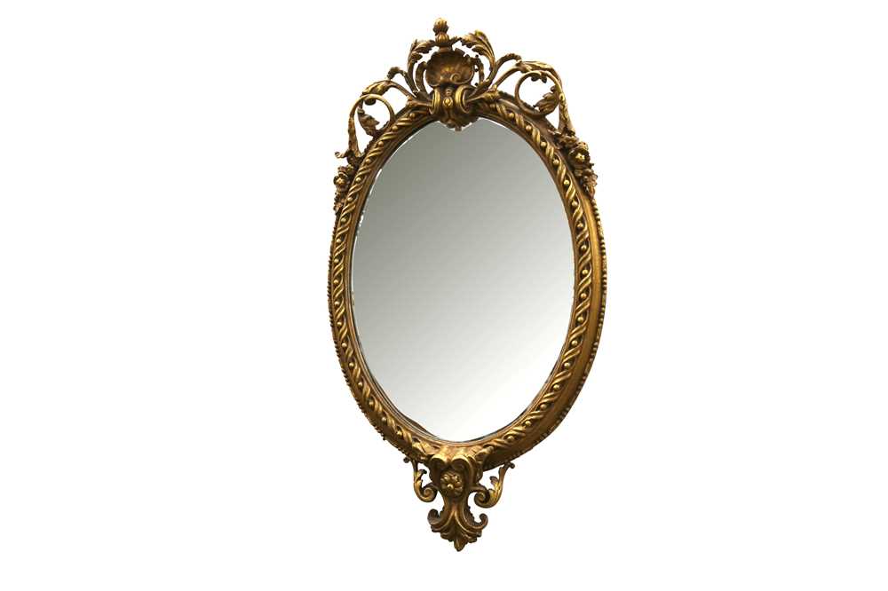 Lot 59 - AN OVAL GILTWOOD AND GESSO MIRROR, IN THE FRENCH TASTE, 20TH CENTURY