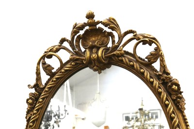 Lot 59 - AN OVAL GILTWOOD AND GESSO MIRROR, IN THE FRENCH TASTE, 20TH CENTURY