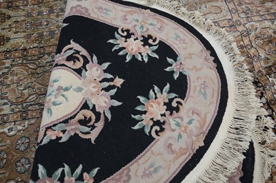 Lot 63 - A CHINESE OVAL WOOL RUG, 20TH CENTURY