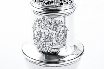 Lot 435 - A pair of George II sterling silver ‘portrait’ sugar casters, London 1731/34 by Thomas Tearle
