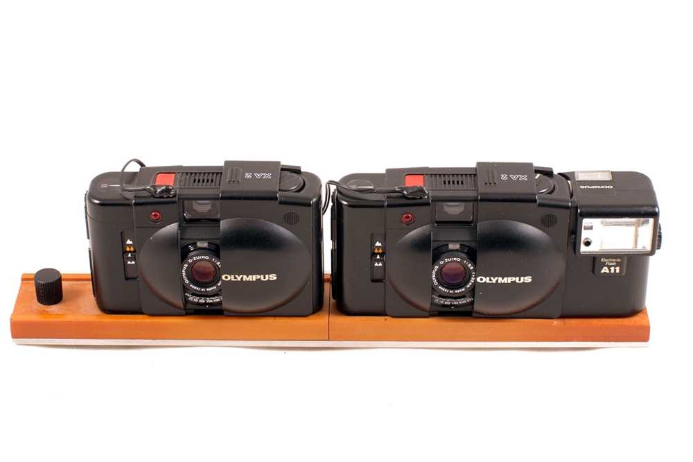 Lot 65 - Twinned & Synchronised Olympus XA2 Cameras for Full Frame Stereo Images.
