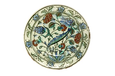 Lot 60 - AN IZNIK POTTERY DISH WITH FLORAL DECORATION