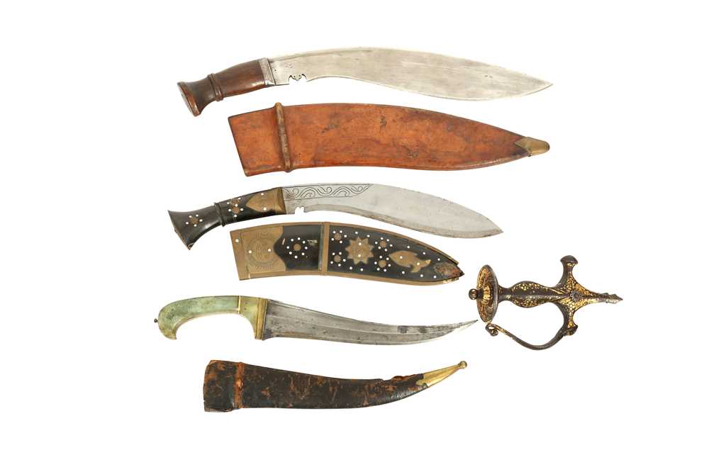 Lot 131 - A GROUP OF THREE INDIAN DAGGERS AND A GOLD-DAMASCENED (KOFTGARI) HILT