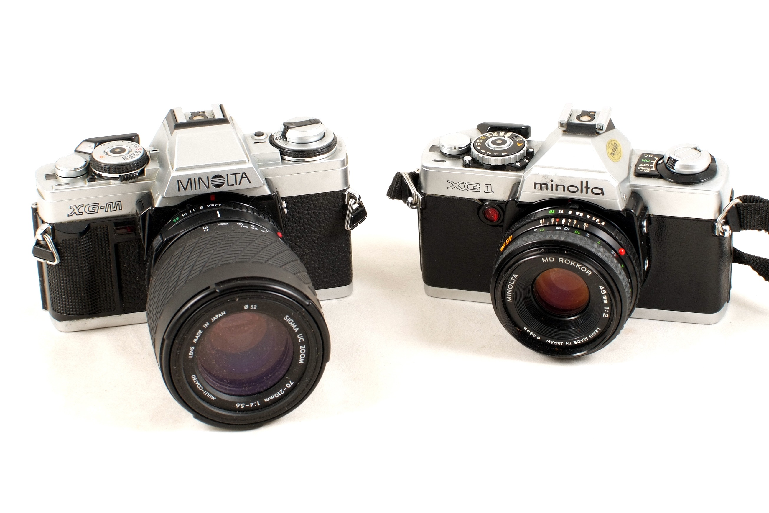 Lot 284 Group of Minolta Film Cameras & Lenses.