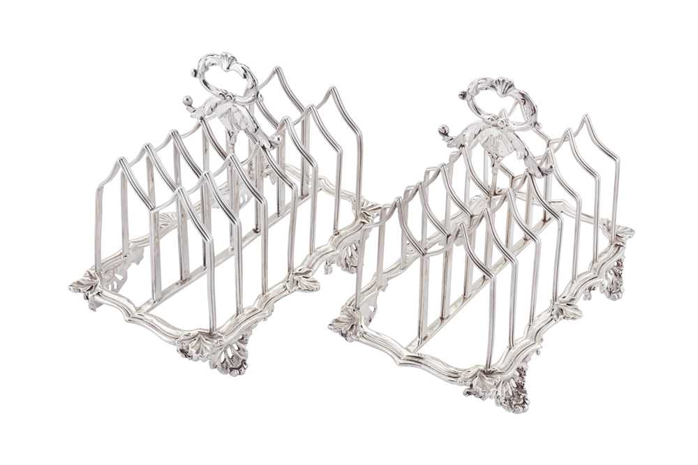 Lot 373 - An assembled pair of William IV sterling silver seven bar toast racks, London 1831/35 by Charles Fox