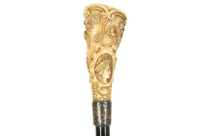 Lot 244 - AN IVORY HANDLED WALKING CANE, 19TH CENTURY