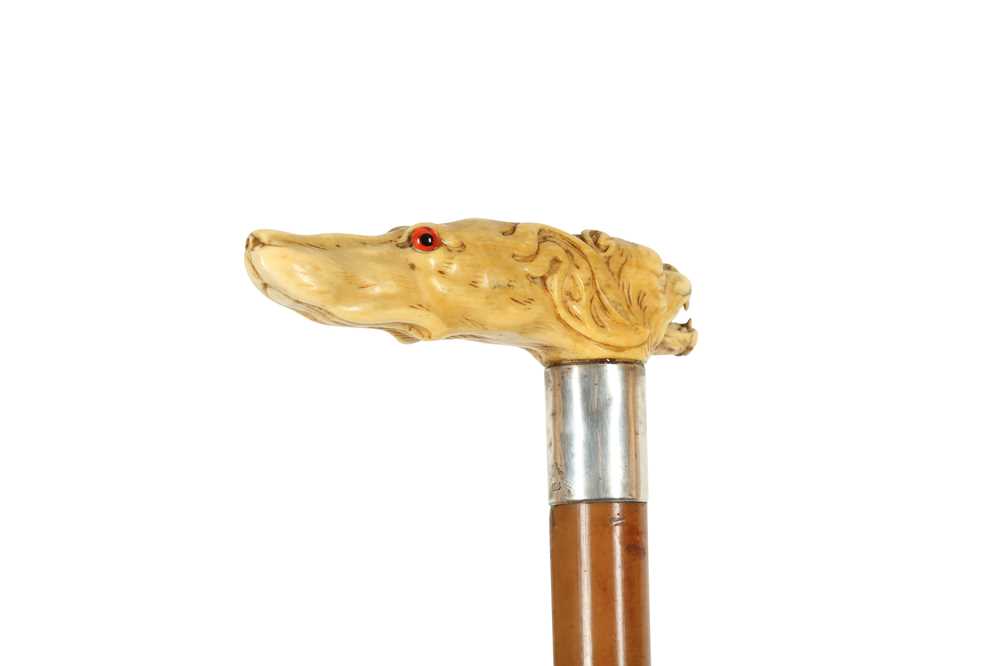 Lot 254 - A CARVED MARINE IVORY HANDLED WALKING CANE, 19TH CENTURY