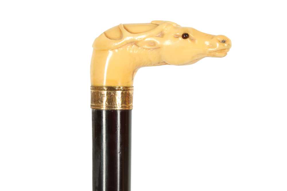 Lot 253 - A CARVED MARINE IVORY HANDLED WALKING CANE, 19TH CENTURY