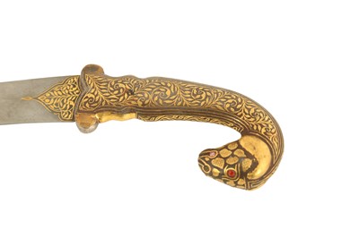 Lot 134 - A GOLD-DAMASCENED (KOFTGARI) RAM-HEADED STEEL DAGGER (KHANJAR)