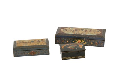 Lot 696 - TWO IRANIAN AND A RUSSIAN POLYCHROME-PAINTED AND LACQUERED LIDDED BOXES