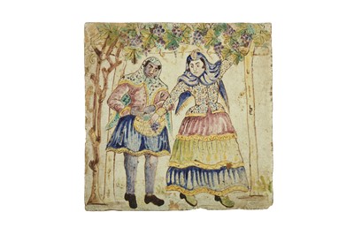 Lot 75 - A LATE QAJAR POLYCHROME-PAINTED POTTERY TILE