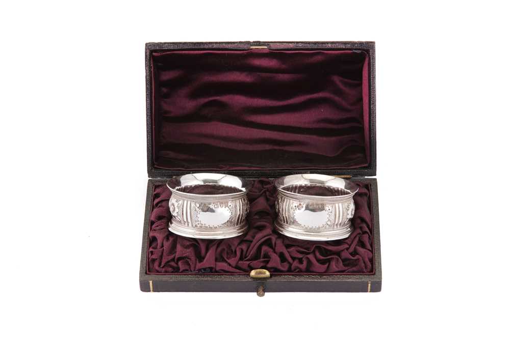 Lot 47 - A cased pair of Victorian sterling silver napkin rings, London 1896 by Horace Woodward & Co Ltd