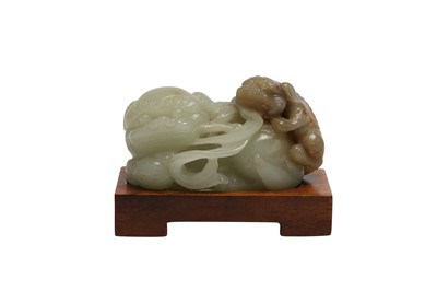 Lot 365 - A CHINESE PALE CELADON JADE 'LION DOGS' GROUP.