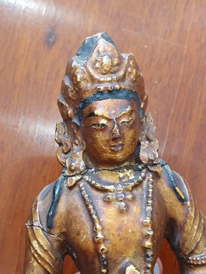 Lot 195 - A CHINESE GILT-LACQUER STUCCO FIGURE OF A BODHISATTVA.