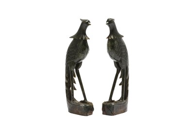 Lot 557 - A PAIR OF CHINESE SPINACH-GREEN JADE 'BIRD' CARVINGS.