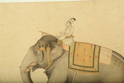 Lot 341 - A TINTED DRAWING OF A MUGHAL PRINCE RIDING AN ELEPHANT