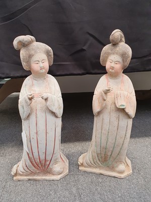 Lot 235 - A PAIR OF CHINESE POTTERY FIGURES OF CORT LADIES.