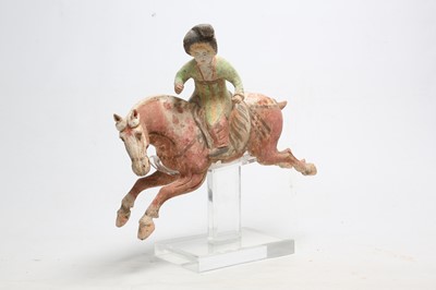 Lot 231 - A CHINESE POTTERY FIGURE OF A POLO PLAYER.