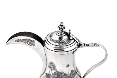 Lot 306 - An early 20th century Iraqi silver and niello Dallah coffee pot, circa 1930, signed Omara, Amer, Raheem