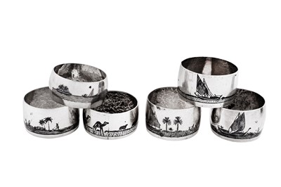 Lot 277 - A mixed group of seven early 20th century Iraqi silver and niello napkin rings, Basra circa 1920-40