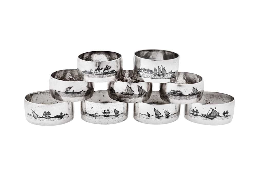 Lot 276 - A mixed group of nine early 20th century Iraqi silver and niello napkin rings, circa 1920-40