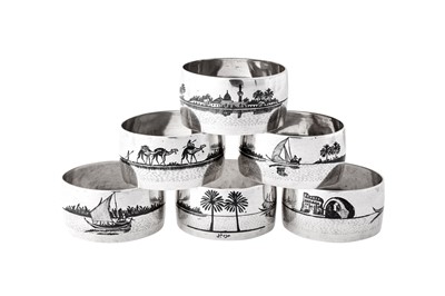 Lot 275 - A set of six mid-20th century Iraqi silver and niello napkin rings, Baghdad dated 1945 signed Dakheel