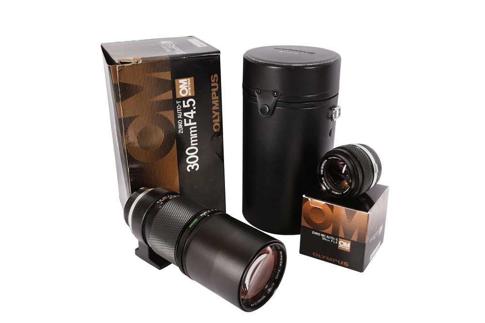 Lot 189 - A Pair of Boxed Olympus OM System Lenses