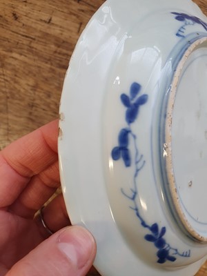 Lot 80 - A CHINESE BLUE AND WHITE 'DESHIMA ISLAND' DISH, TOGETHER WITH A JAPANESE VERSION OF THE SAME DISH.