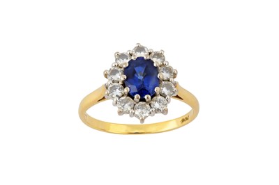 Lot 141 - A sapphire and diamond cluster ring, 1987
